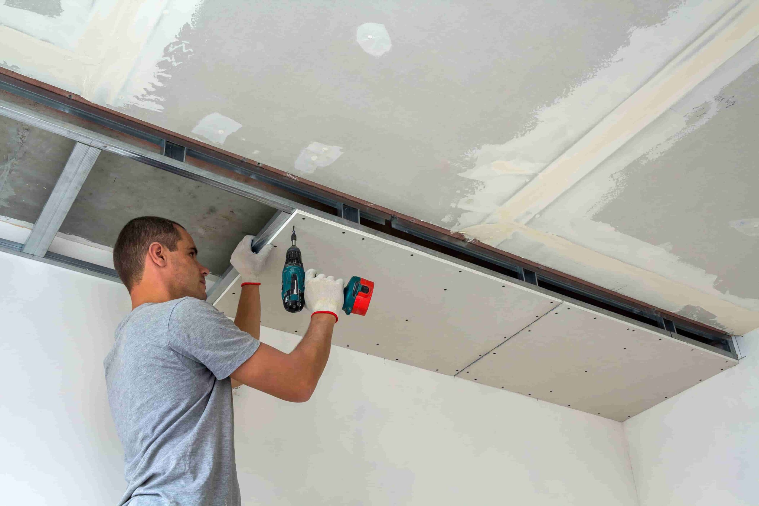 man assembling plasterboard